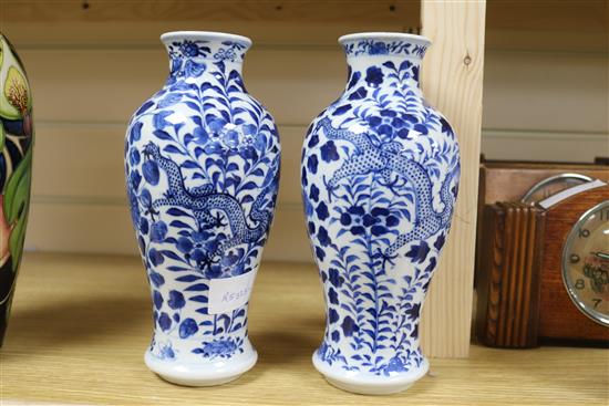 A pair of Chinese blue and white vases 23cm.